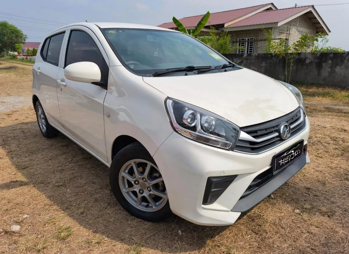 White Perodua Axia rental car