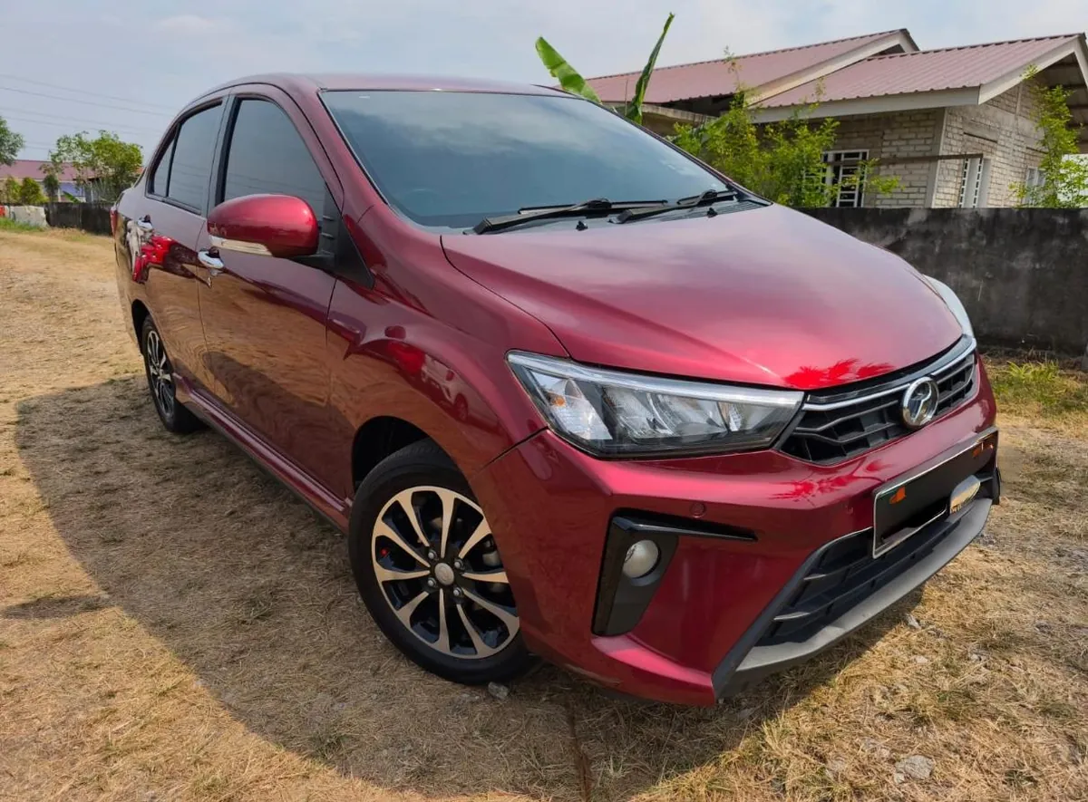 Red Perodua Bezza rental car