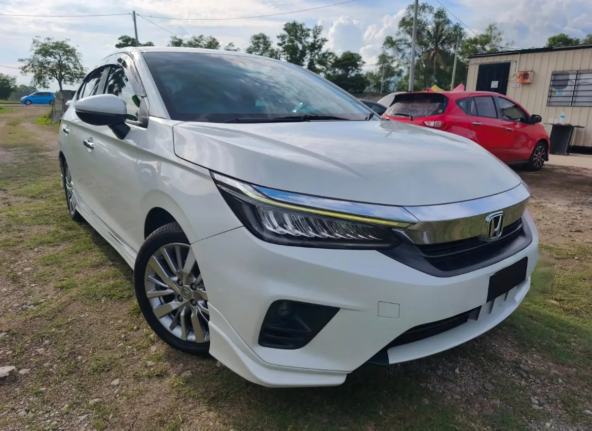 White Honda City rental car